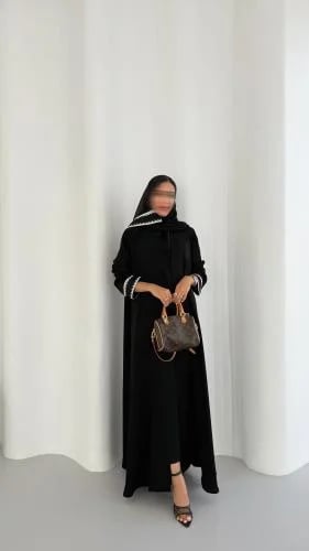 Black crepe abaya with trim on the sleeves and a flared-cut headscarf