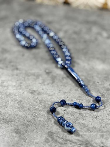 A blue mixed plastic rosary for ownership