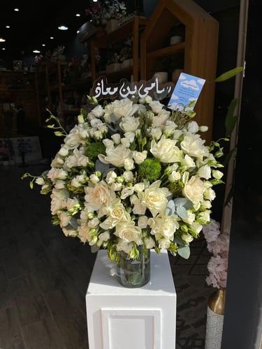 A large-sized elegance with a vase of Damask rose...