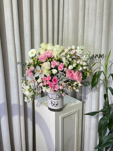 A vase named with luxurious arrangement of the ros...