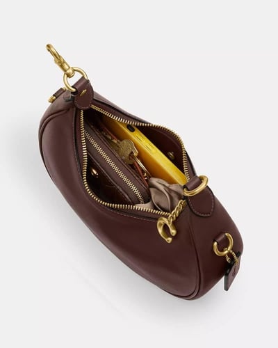 حقيبة جوني من ماركة كوتش-ألوان متعددة