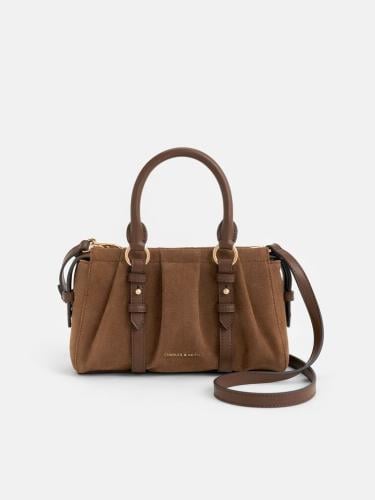 حقيبة بريتون صغيره مع ميدالية بمقبض علوي من جلد ال...