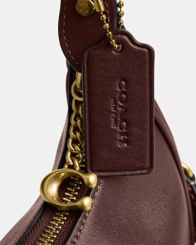 حقيبة جوني من ماركة كوتش-ألوان متعددة