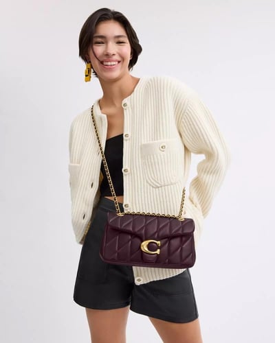 حقيبة كتف تابي 26 ماركة كوتش- لون خمري