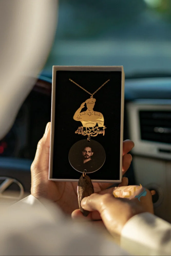 A car pendant plated with gold or silver with oud...
