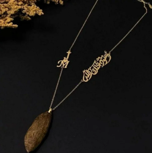 A car pendant plated with gold or silver with oud...