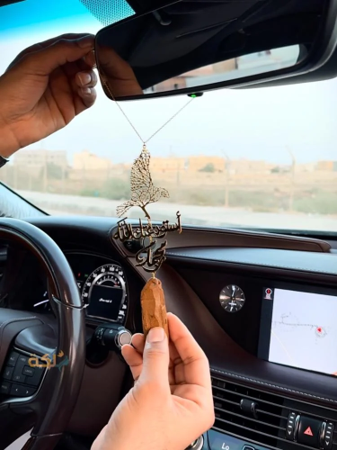 A car pendant plated with gold or silver with oud engraved with the name according to your request
