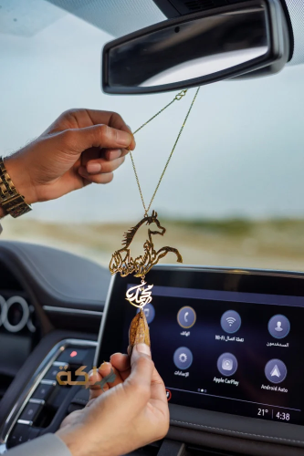 A car pendant plated with gold or silver with oud...