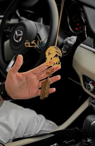 A car pendant plated with gold or silver with oud engraved with the name according to your request