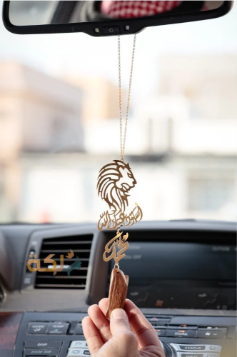 A car pendant plated with gold or silver with oud...