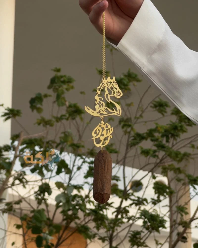 A car pendant plated with gold or silver with oud...