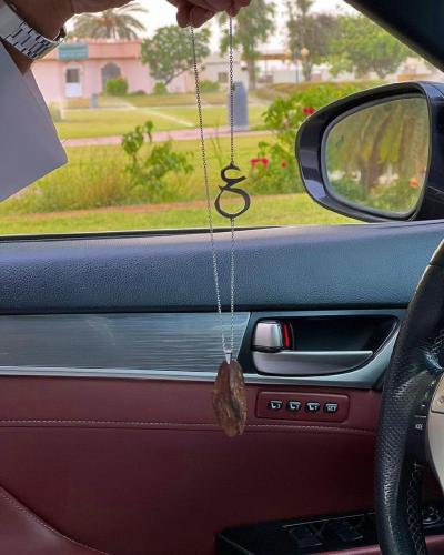 A car pendant plated with gold or silver with oud engraved with the name according to your request