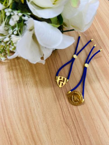 A string bracelet plated with gold or silver