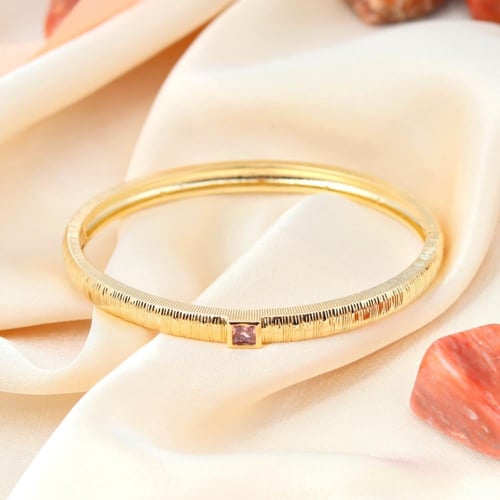 سوار مطلي بالذهب مزين بكريستال متوهج