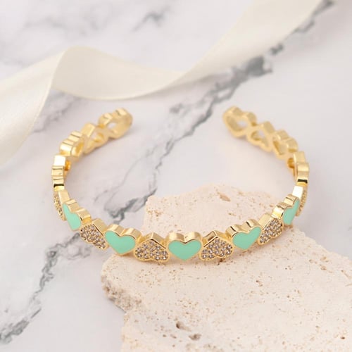 سوار مطلي بالذهب شكل قلوب متصلة