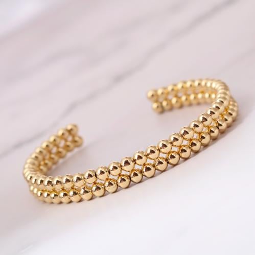 سوار مطلي بالذهب شكل كور