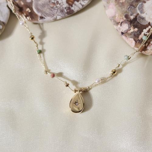 قلادة مصنوعة من الخيط مزينة باللؤلؤ الطبيعي والأحج...