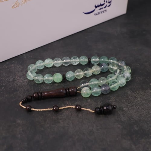 حبكة من الفلورايت وخشب الأبانوس ٣٣ خرزة