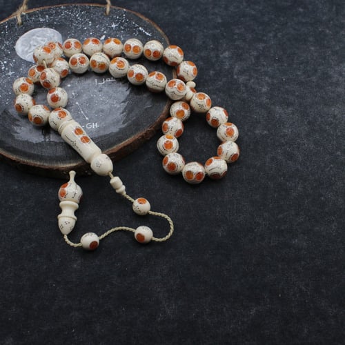 سبحة فاخرة من عاج الفيل والكهرمان