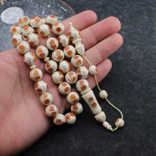 سبحة فاخرة من عاج الفيل والكهرمان