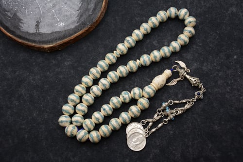 مسباح عاج مع الفيروز والفضة