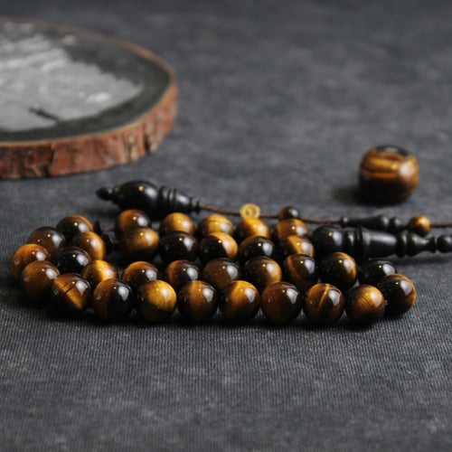 سبحة حجر عين النمر مع خشب الأبانوس