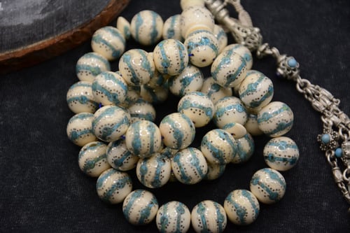 مسباح عاج مع الفيروز والفضة