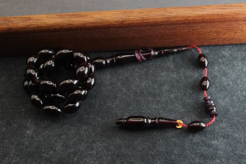 سبحة عنبر كهرمان بنفسجي غامق