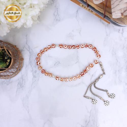 سبحة أحمر بعروق أبيض