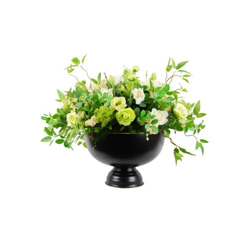 أوراق الشجر البيضاء والخضراء في وعاء برونزي