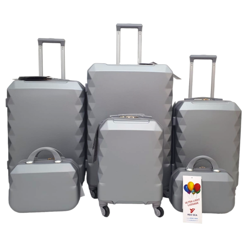 طقم حقائب سفر فايبر 6 قطع بجوانب مدببة لون فضي