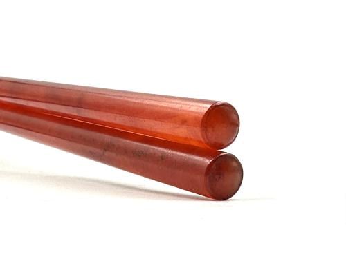 Bakelite sticks, American Tartarok, or old cast iron.