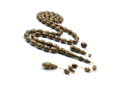 A Bakelite desk-style rosary made from a lighter (Al-Wawi), an old cast iron, lathe work by Aqeel Al-Turki