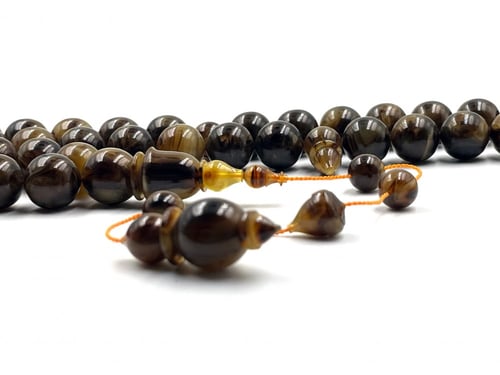 سبحة بكلايت مفروزة من عصي ضبعة معرقة بشفافية صب قد...