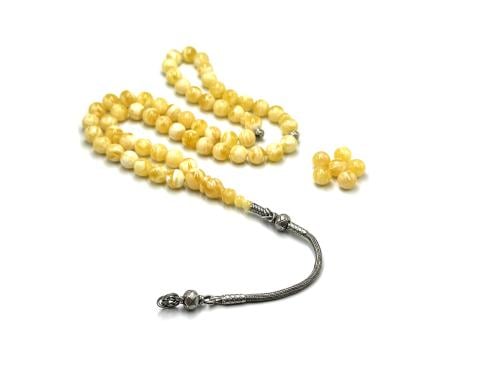 Amber rosary, whitewashed with plaster