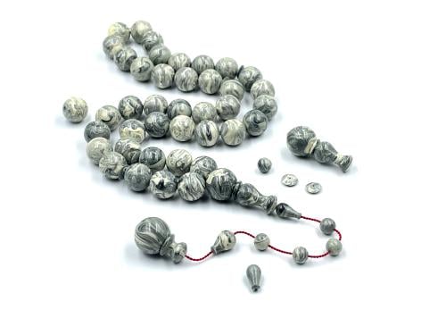 A rosary made from the handles of the Chernobyl-era Akrouki, sorted, old cast iron, lathe work by Firas Khanu