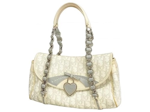 Dior – (Vintage Heart Lock Underarm Bag)
