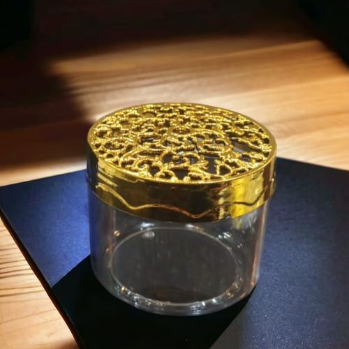 A set of 12 round packaging boxes with a gold lid