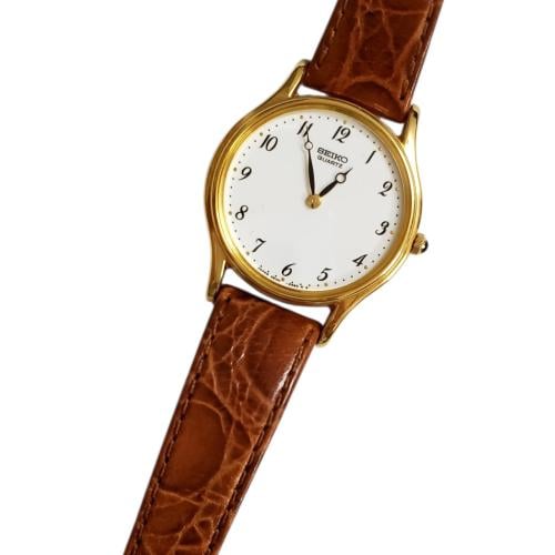 ساعة سيكو الرقيقة انالوج كوارتز المميزة (thin watch) 26mm مينا أبيض أرقام انجليزية حزام جلد فاخر لون بني للنساء - Vintage S1