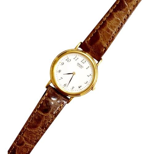ساعة سيكو الرقيقة انالوج كوارتز المميزة (thin watch) 24mm مينا أبيض أرقام انجليزية حزام جلد فاخر لون بني للنساء - Vintage S5