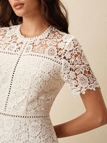 Anewsta short-sleeved dress with a patchwork desig...