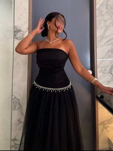 Black top and skirt decorated with crystal and pearl