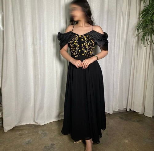 Black dress decorated with gold