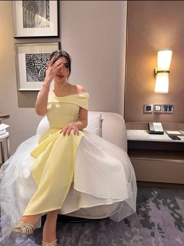Yellow top and white skirt decorated with pearls