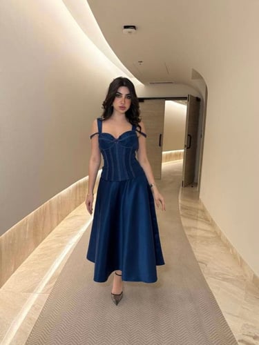Blue top skirt decorated with white threads