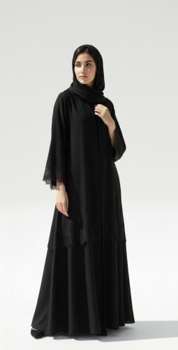 A soft abaya, a smooth model decorated with French...