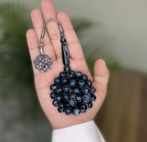 A prayer bead with a clasp