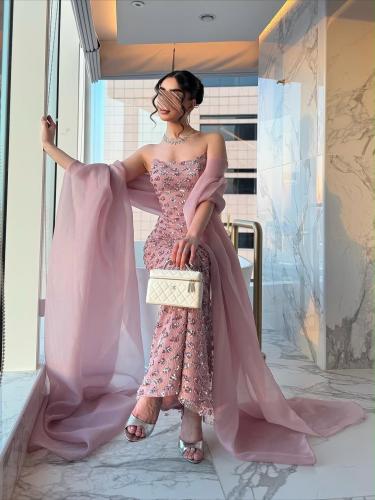 Pink evening dress embroidered with shiny sequins with a soft organza shawl