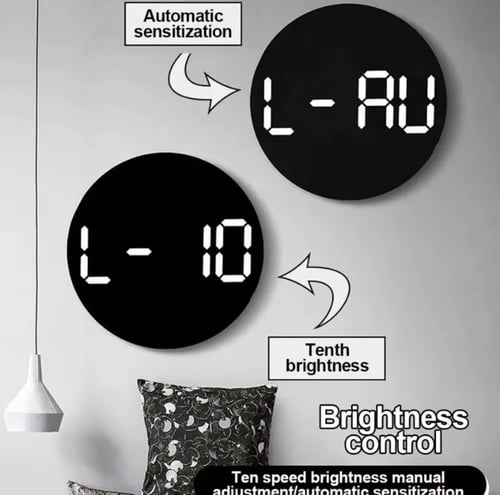 ساعة حائط رقمية حديثة تتميز بتصميم دائري أنيق. تعر...