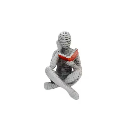 مجسم زخرفي لشخص يقرأ كتابًا، صُمم لإضفاء لمسة جمال...